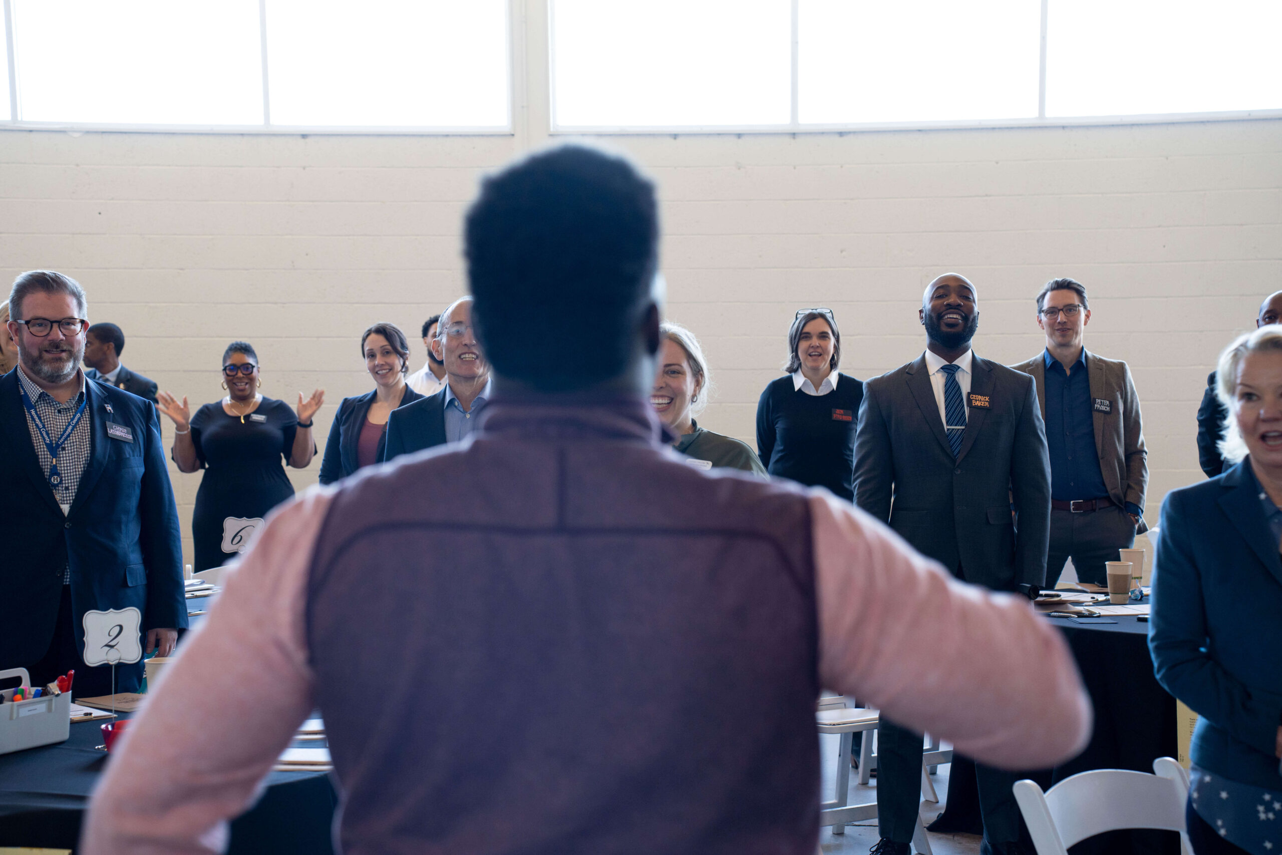 A person leading a session with a group of people